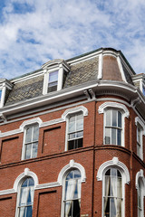 Old Brick Building with White Arches Over Windows