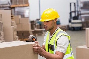 Worker preparing goods for dispatch