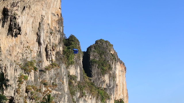 man does parachute jump from cliff	