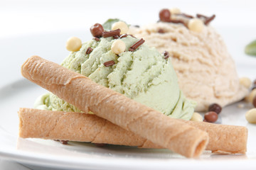 scoops of ice cream on a white plate