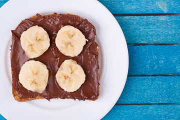 bread with chocolate spread and banana