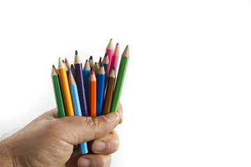 colorful pencils in hand isolated on white background