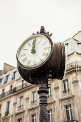Fototapeta na wymiar Paris street view detail of a street clock