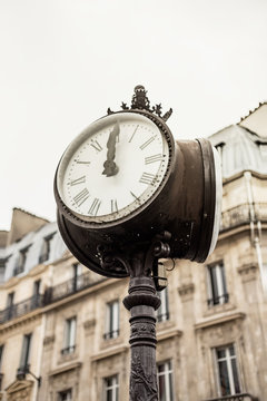 Paris street view detail of a street clock