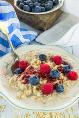 Oatmeal porridge with fresh berries