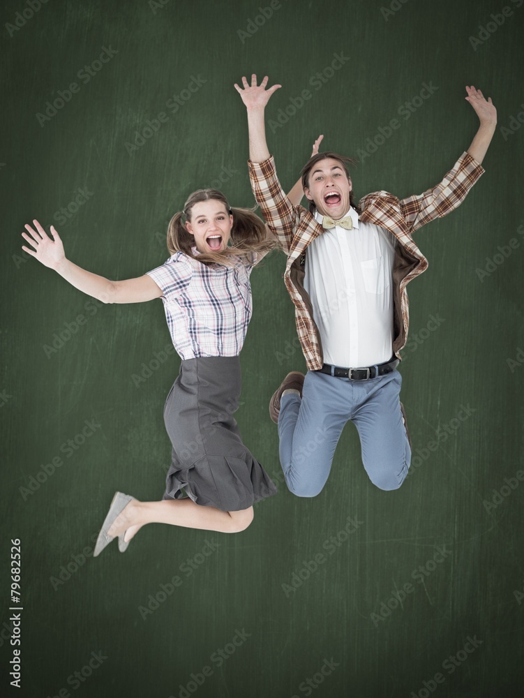 Poster Composite image of geeky hipsters jumping and smiling