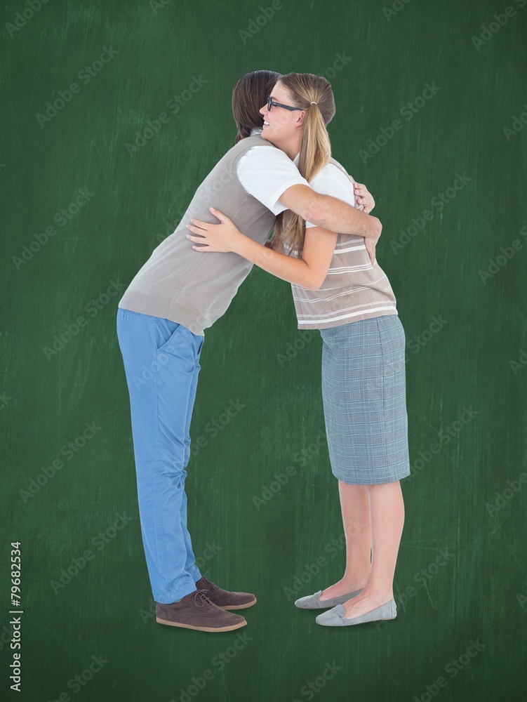 Poster Composite image of geeky hipster couple hugging