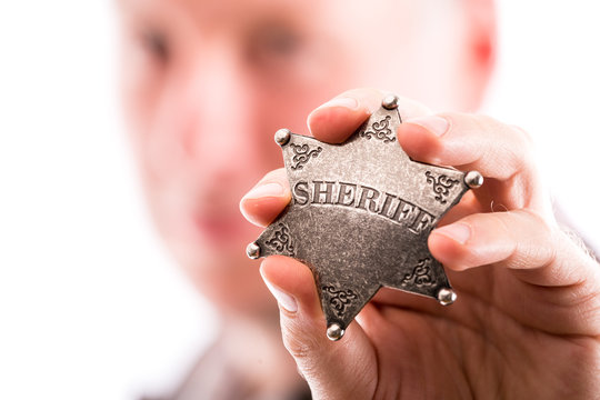 Man holds sheriff badge