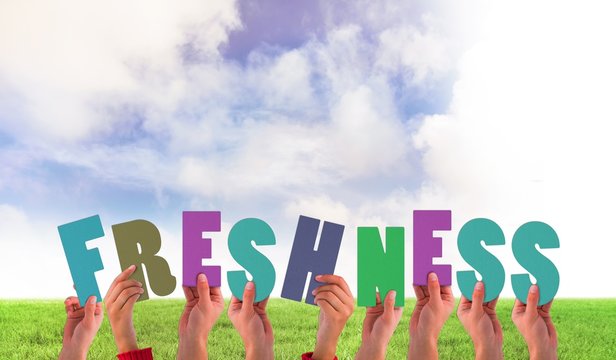 Composite image of hands holding up freshness
