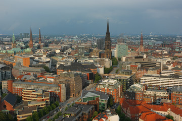 Fototapeta na wymiar Center of Hamburg. View on the center of Hamburg from a height of St. Michaelis tower. View on St. Nikolai Memorial.