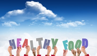 Composite image of hands holding up healthy foods