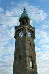 Water level tower in Hamburg. Clock tower (Pegelturm) on the Landungsbruecken station, St. Pauli in Hamburg. There is a water level indicator which indicates the current stage of the tides.