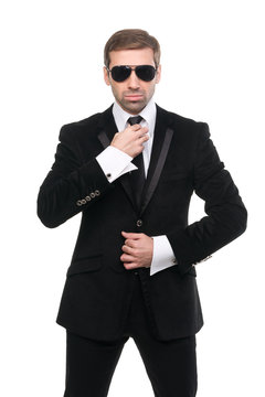 Stylish bodyguard with sunglasses. Isolated over white backgroun