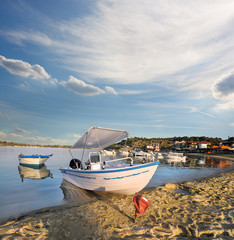 Motor boat in Ormos Panagias bay in Sithonia, Greece