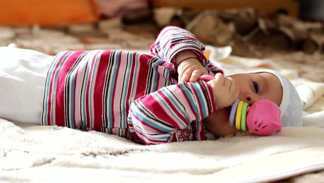 Baby with Toy in Hands