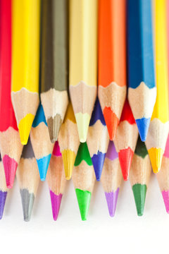 Colored pencils closeup on a white background