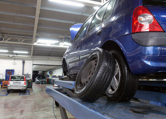 Fototapeta na wymiar car in garage with special equipment prepared for repair