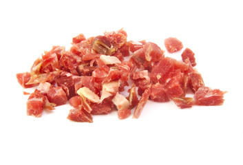 Bunch of sliced spanish serrano ham on white background
