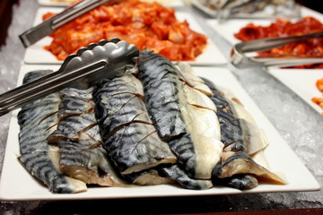 saba fish on a white plate.