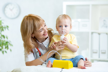 Doctor holding inhaler mask for child breathing