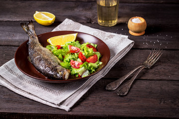 fish with salad and white wine
