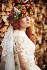 Fototapeta premium Beautiful red hair bride with flowers