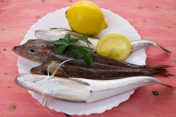 mullet with lemon on the plate