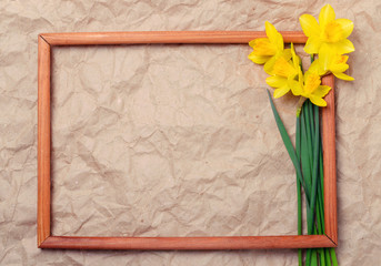 bouquet of yellow daffodils on crumpled paper