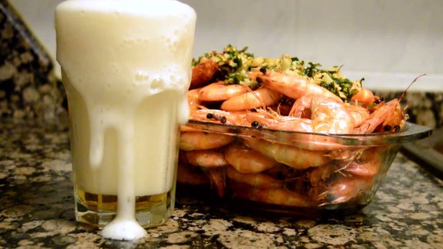 Beer Pouring Out Of Cold Glass With Shrimps