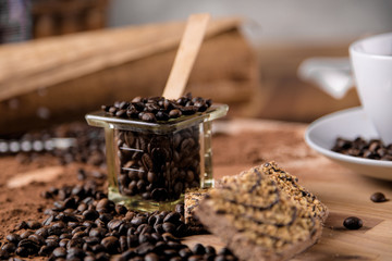 Dark concept with coffee on wooden table, organic