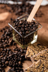 Dark concept with coffee on wooden table, organic