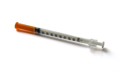 Medicine syringe on isolated white background