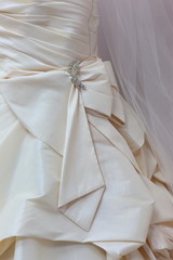 Obraz na płótnie Canvas Fragment of a wedding dress.