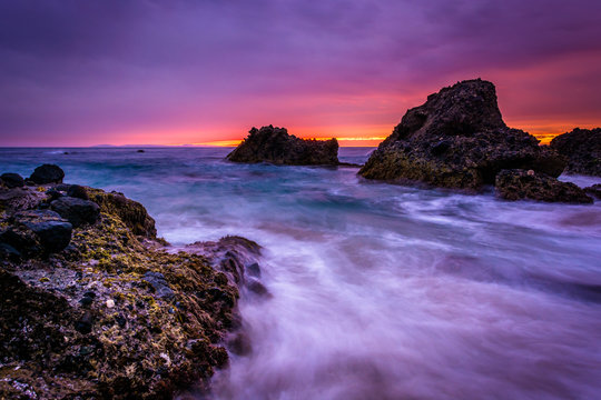 Waves and rocks in the Pacific Ocean at sunset, at Woods Cove, i