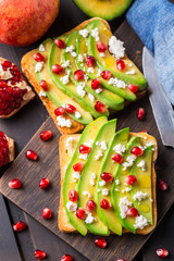 Avocado sandwich with feta and pomegranate