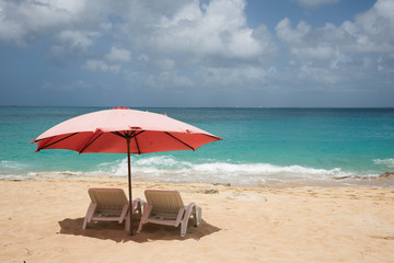 Beach loungers at Baie Rouge 2