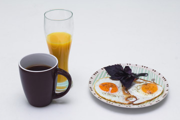 Breakfast with coffee, orange juice and eggs