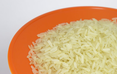 Brown Rice on orage dish Background