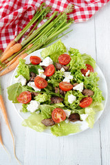 salad with chicken liver. cherry tomatoes and feta cheese