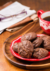 Homemade chocolate cookies on red plate