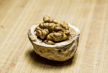 Chopped Walnut rests on a wooden  board