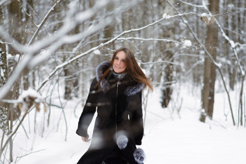 Woman in winter forest