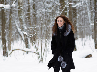 Woman in winter forest