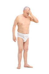 Fototapeta premium Full length portrait of an upset senior in underwear