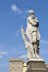 Fototapeta na wymiar Ponte Santa Trinita Winter statue in Florence