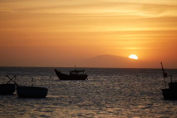 Fototapeta na wymiar Fishing boats at sunset