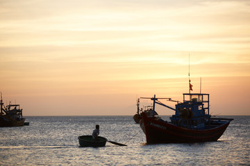 Fototapeta premium Fishing boats at sunset