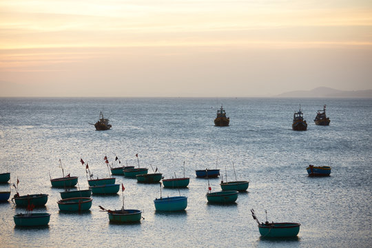 Fishing boats at sunset