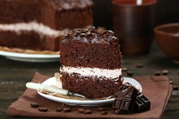 Delicious chocolate cake on table close-up