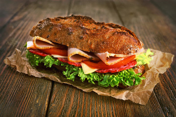 Fresh and tasty sandwich with ham and vegetables